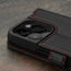 Camera cutout on the Black with Red Detail Leather Wallet Case for iPhone 15 Pro Max