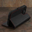 Integrated stand function of the Black with Red Detail Leather Wallet Case for iPhone 15 Pro Max