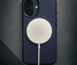 MagSafe charger connected to the Blue Leather Slimline Bumper Case for iPhone 16