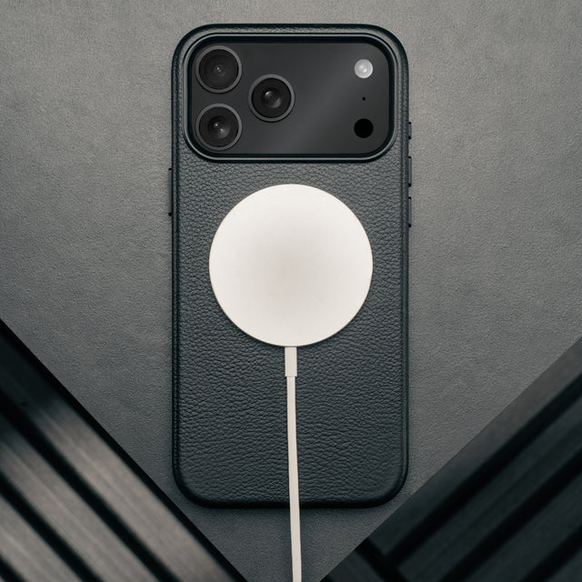 MagSafe charger attached to the Slimline Black Leather Bumper Case for iPhone 17 Pro Max