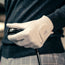 Man wearing the Cabretta Leather White Golf Glove and holding a golf club