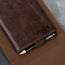 Magnetically attachable scorecard holder in the PRO Edition of the Dark Brown Leather Golf Scorecard & Yardage Book Holder
