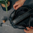 Inside view of the two storage compartments in the Black Leather Wash Bag