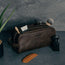 Toiletry items in the Dark Brown Leather Wash Bag