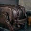 Double zipped sections, carry handle and detachable strap of the Dark Brown Leather Wash Bag