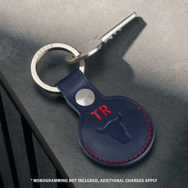 Navy Blue with Red Detail Leather Apple AirTag Holder Keyring attached to a key