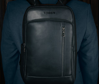Black Leather Backpack carried on model's back