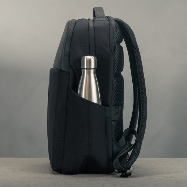 Side profile of the Black Classic Commuter Backpack with bottle pocket