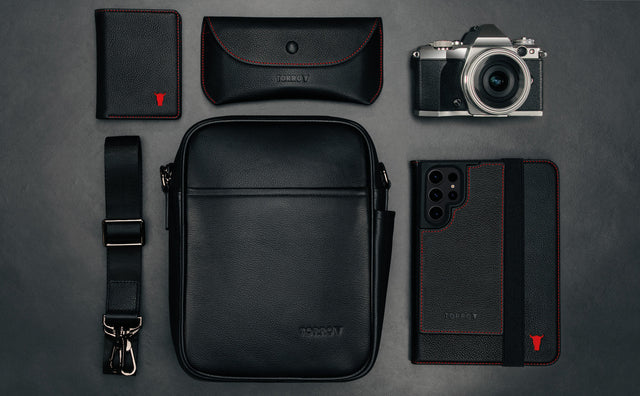 Black Crossbody Bag with products to show size and capacity