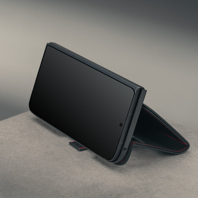 Closed phone in the stand function of the Black with Red Stitching Leather Case for the Google Pixel 11 Pro Fold