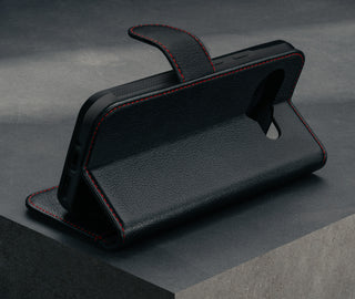 Stand feature of the Black with Red Detail Leather Wallet Case for Google Pixel 9