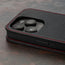 Camera cutout on the Black with Red Detail Leather Flip Case for iPhone 15 Pro