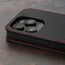 Camera cutout on the Black with Red Detail Leather Flip Case for iPhone 15 Pro Max