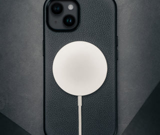 MagSafe charger attached to the Slimline Bumper Case for iPhone 15