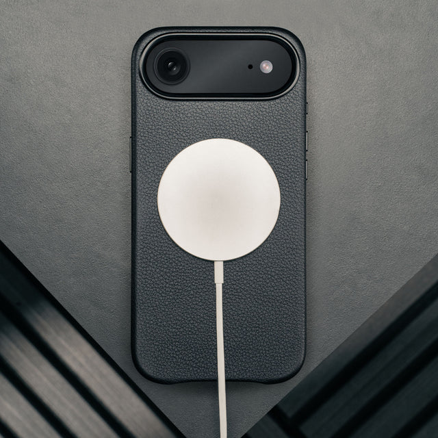 MagSafe charger attached to the Black Leather Bumper Case for iPhone 17 Air