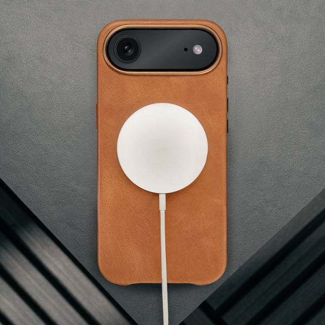 MagSafe charger attached to the Tan Leather Bumper Case for iPhone 17 Air