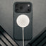 MagSafe charger attached to the Slimline Black Leather Bumper Case for iPhone 17 Pro Max