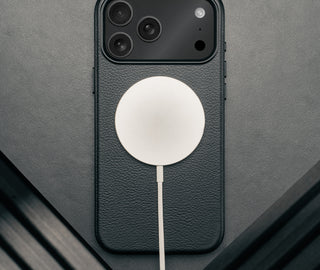 MagSafe charger attached to the Slimline Black Leather Bumper Case for iPhone 17 Pro Max