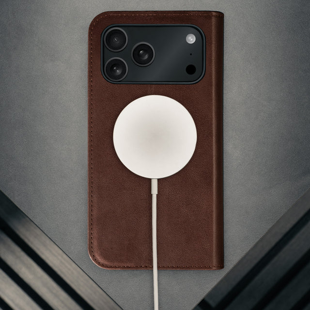 MagSafe charger attached to the Dark Brown Leather Case for iPhone 17 Pro Max