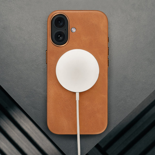MagSafe charger attached ot the Tan Leather Bumper Case for iPhone 17