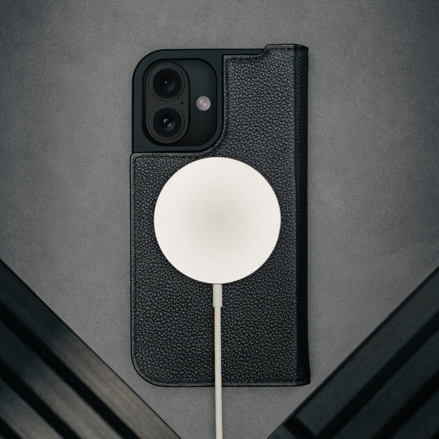 MagSafe charger attached to the Black Leather Case for iPhone 17