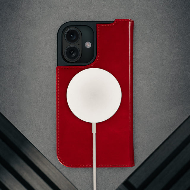 MagSafe charger attached to the Red Leather Case for iPhone 17