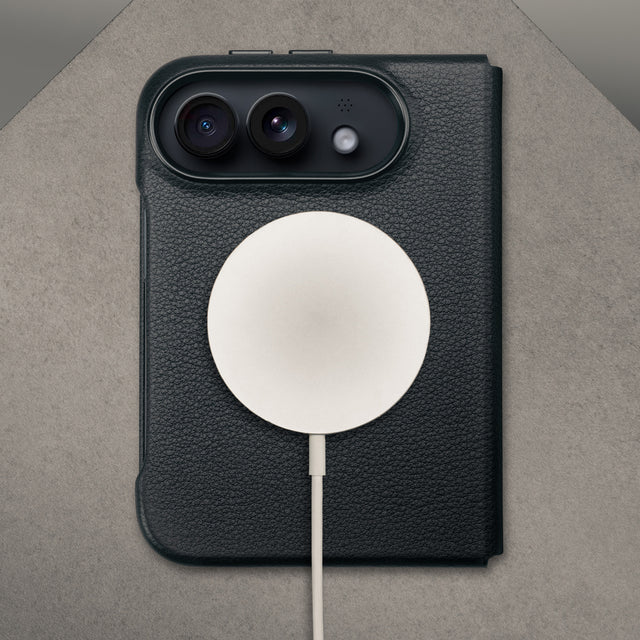 MagSafe charger attached to the Black with red detail Leather Folio Case (with Rotating Stand) for the iPhone Ultra