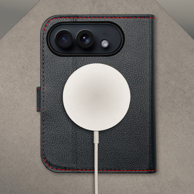 MagSafe charger attached to the Black with Red detail Leather Wallet Case for the iPhone Ultra