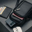 Three zipped compartments of the Black Leather Phone Bag with iPhone and Passport