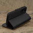 Stand feature of the Black with Red Detail Leather Wallet Case for Samsung Galaxy S24