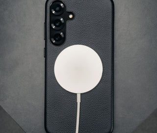 MagSafe charger attached to the Black Slimline Leather Bumper Case for Galaxy S25+