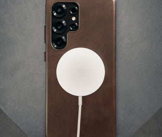 MagSafe charger attached to the Dark Brown Slimline Leather Bumper Case for Galaxy S25 Ultra