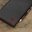Holding the Black with Red Detail Leather Golf Scorecard Holder
