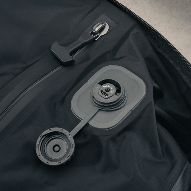 Integrated, rechargable vacuum pump in the Black eith Red Detail Travel Backpack