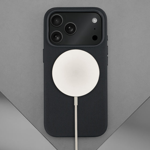 Wireless charger attached to the Black Woven Texture Bumper Case for iPhone 17 Pro