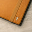 TORRO logo to the front of the Tan Leather Stand Case for iPad 10.2