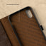 Highlighting the microfibre lining of the Dark Brown Leather Stand Case for iPhone XS / X