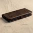 Showing the side magnetic closure and durable silicone frame of the dark brown leather stand case for iPhone XS / X