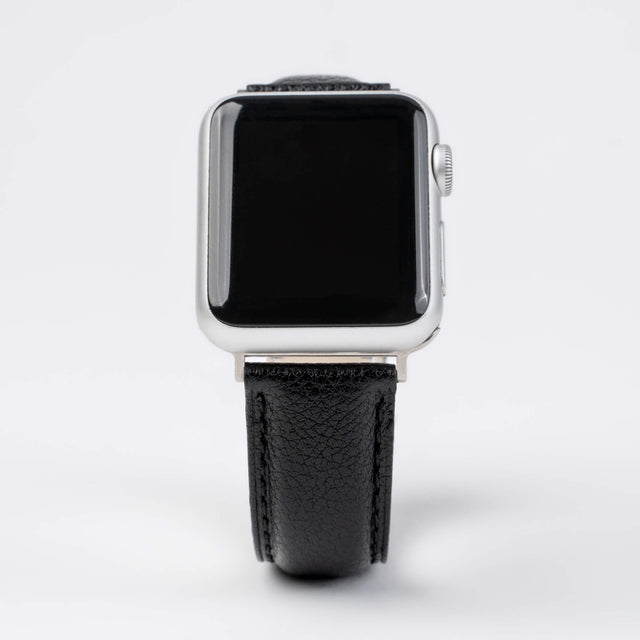 Close up of an Apple Watch with a Black Leather Strap