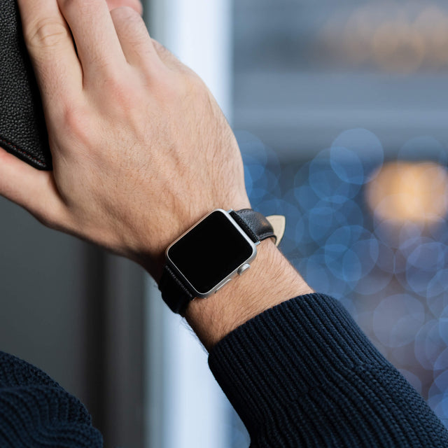 Model wearing the Black Leather Apple Watch Strap on his wrist