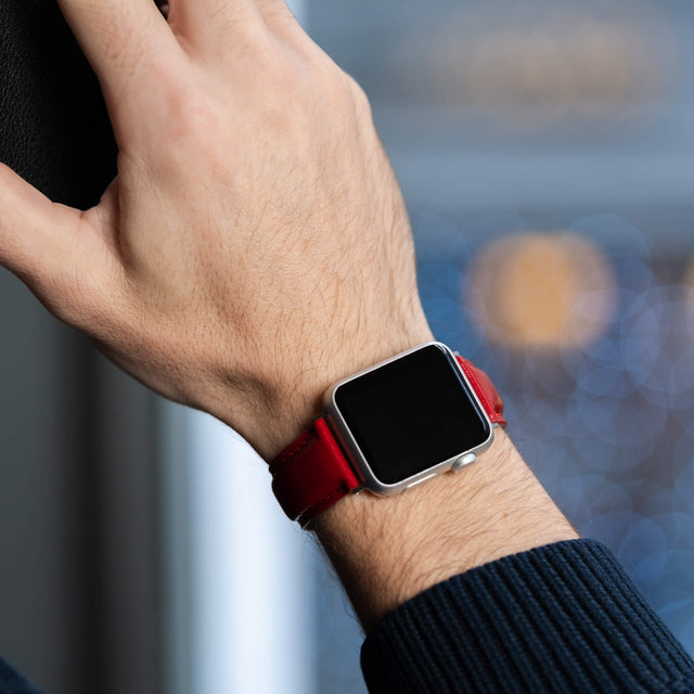 Model wearing the Red Leather Apple Watch Strap on his wrist