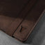 Close up fo the leather grain and TORRO bulls head logo on the Dark Brown Leather Case for iPad Pro 11-inch