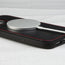 MagSafe charger attached to the Black (with Red Stitching) Leather Bumper Case for iPhone 14
