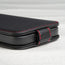 Magnetic closure tabs on the Black (with Red Stitching) Leather Flip Case for iPhone 14