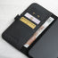 Card and note storage in the Black Leather Folio Stand Case for iPhone 14