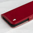 Close up of the leather texture and TORRO bull's head logo on the Red Leather Leather Folio Stand Case for iPhone 14