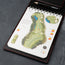 Yardage book in the PRO Edition of the Black with Red Detail Leather Golf Scorecard & Yardage Book Holder