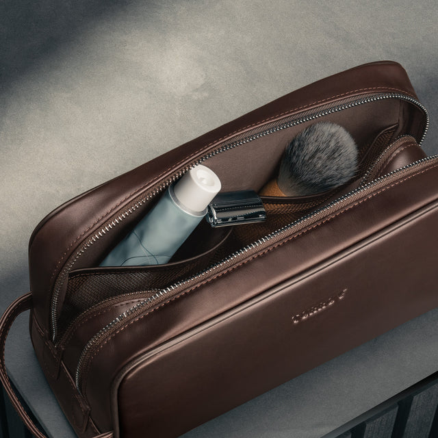 Toiletry items in the Dark Brown Leather Wash Bag