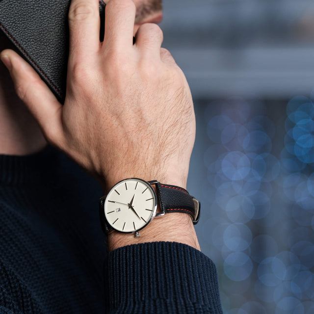 Man wearing the Luxury Black with Red Stitching Leather Watch Strap whilst talking on the phone