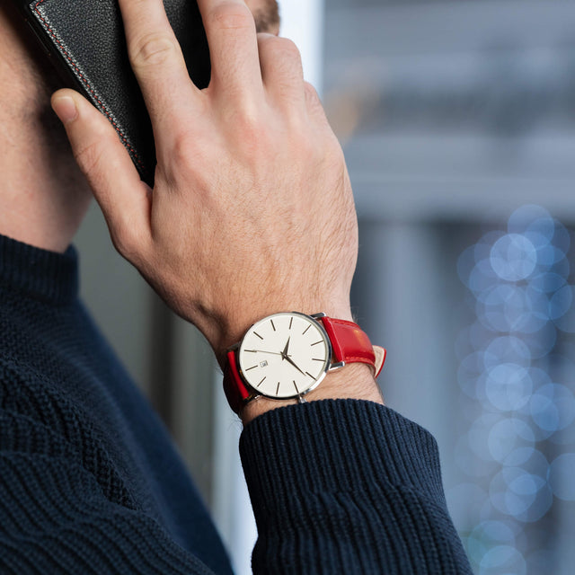 Man wearing the Luxury Red Leather Watch Strap whilst talking on the phone